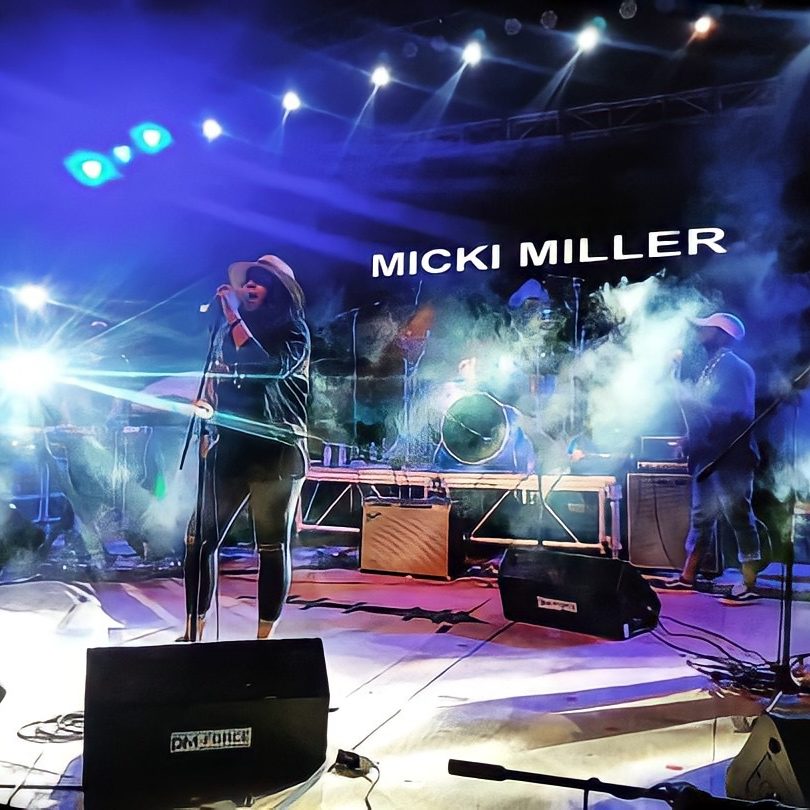 Micki Miller performing at an event.